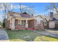 Charming brick bungalow with a covered porch and original architectural details at 732 Cascade Ave, Atlanta, GA 30310
