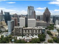 Stunning aerial view of condominium building amidst the vibrant Atlanta skyline, a luxurious city living experience at 145 15Th Ne St # 843, Atlanta, GA 30309