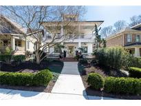Beautiful two-story home with a welcoming front porch and well-manicured landscaping at 1601 Marlbrook Ne Dr, Atlanta, GA 30307