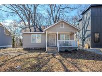 Charming one-story home with a cozy front porch and inviting curb appeal at 1324 North Avenue, Atlanta, GA 30318
