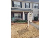 Charming two-story home with a well-maintained front yard and inviting entrance at 2744 Snapfinger Mnr, Stone Mountain, GA 30035