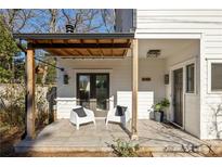 Inviting front porch with stylish seating and a covered entrance; address number is visible at 2148 Palifox Ne Dr, Atlanta, GA 30307