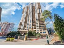 Beautiful exterior view of a high rise condominium with balconies on a sunny day at 3481 Lakeside Ne Dr # 2303, Atlanta, GA 30326