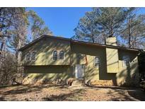 Charming single-Gathering home featuring many windows, a stone foundation, and a classic suburban design at 185 Windhaven Sw Trl, Atlanta, GA 30331