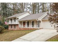 Charming home featuring a welcoming front porch and a spacious two-car garage at 2574 Sugarplum Ne Ct, Atlanta, GA 30345