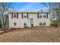 Charming split-level home with a well-manicured lawn and classic curb appeal at 6645 Doublegate Ln, Rex, GA 30273