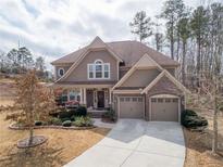 Charming two-story home with a well-manicured lawn and a two-car garage at 5116 Barton Pass, Acworth, GA 30101
