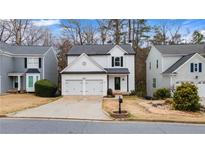 Charming two-story home with a two-car garage and well-maintained landscaping at 1050 Westwell Run, Alpharetta, GA 30022