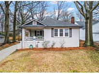 Charming one-story home with a covered front porch and a well-maintained yard at 942 Byron Sw Dr, Atlanta, GA 30310
