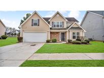 Charming two-story home with a well-manicured lawn and attached two-car garage in a Gathering-friendly neighborhood at 3248 Meadow Point Dr, Snellville, GA 30039