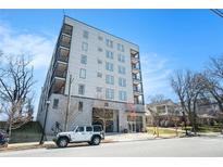 Modern apartment building with balconies, complemented by street parking and landscaped surroundings at 525 Parkway Ne Dr # 314, Atlanta, GA 30354