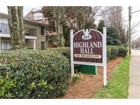 Sign for Highland Hall on Briarcliff with fresh landscaping in front of brick buildings and trees at 869 Briarcliff Ne Rd # B25, Atlanta, GA 30306