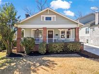 Charming craftsman style home with a cozy front porch and manicured landscaping at 949 Park Se Ave, Atlanta, GA 30315