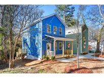 Charming blue two-story home with a welcoming front porch and modern design at 2664 Brown Nw St, Atlanta, GA 30318