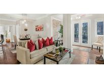Inviting living room featuring hardwood floors, recessed lighting, and neutral color scheme at 2840 Peachtree Nw Rd # 301, Atlanta, GA 30305