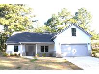 Charming single-Gathering home features neutral paint, attached garage, and inviting front porch at 84 Jennifer Ln, Covington, GA 30016