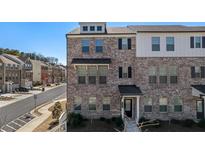 Attractive brick townhome with a welcoming front entrance and well-maintained landscaping at 1570 Halbrook Pl, Marietta, GA 30008