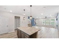 Modern kitchen features a granite island, stainless appliances, and an open floor plan at 1570 Halbrook Pl, Marietta, GA 30008
