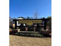 Community sign for Chestnut Grove, a Starlight Homes community, surrounded by brickwork and landscaping at 2003 Ayla Dr, Douglasville, GA 30135