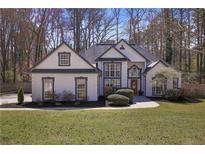 Charming two-story home with manicured lawn and mature landscaping at 2647 Old Hickory Nw Dr, Marietta, GA 30064