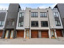 Modern townhome exterior showing brick facade and attached garages at 105 City View Ne Ct, Atlanta, GA 30308