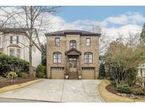 Charming brick two-story home with a two-car garage and inviting curb appeal at 3081 Dickson St, Brookhaven, GA 30319