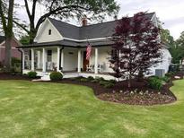 Charming two-story home with a welcoming front porch and meticulously landscaped front yard at 2982 N Main Nw St, Kennesaw, GA 30144