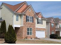 Charming two-story home with stone accents, neat lawn and a two car garage at 735 Briarhurst Ct, Lawrenceville, GA 30046