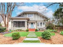 Charming craftsman home with a manicured front yard and inviting blue door at 15 Northwood Ne Ave, Atlanta, GA 30309