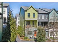 Charming exterior of townhome with a quaint balcony, colorful facade, and inviting front yard at 765 Aerial Way, Atlanta, GA 30316