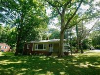 Charming home with mature trees and a well-maintained front yard at 1624 Beatie Ave, Atlanta, GA 30310