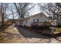 Charming home featuring a deck and well-lit surroundings and long driveway at 61 Daisy Cir, Canton, GA 30114