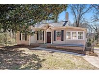 Charming single-story home with neutral siding, black shutters, and well-maintained front lawn at 495 Hutchens Se Rd, Atlanta, GA 30354