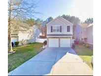 Charming two-story home featuring a two-car garage and well-maintained lawn at 3466 Carriage Chase Rd, Atlanta, GA 30349