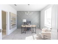 Bright office featuring gray accent wall, modern desk, stylish chair, and light gray carpet at 522 Healy Dr # 66, Cumming, GA 30040