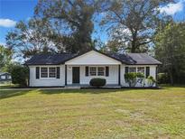 Charming home featuring a manicured front yard and a classic, welcoming facade at 463 Flint Trl, Jonesboro, GA 30236