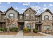 Charming townhome featuring brick and siding, complemented by well-maintained landscaping at 2783 Bayrose Cir # 83, Atlanta, GA 30344