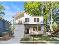 Charming two-story new construction home with a welcoming front porch and a one car garage at 61 Newcastle Sw St, Atlanta, GA 30314