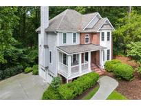Charming two-story home with a welcoming front porch and well-maintained landscaping at 2690 Valvedere Dr, Brookhaven, GA 30319