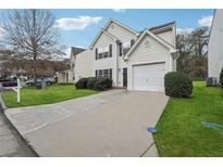 Charming two-story home with a driveway, one-car garage, and well-maintained lawn at 356 Clearsprings Dr, Lawrenceville, GA 30046
