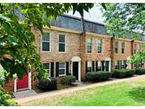 Charming brick townhomes with well-maintained landscaping and neutral colors at 235 Winding River Dr # B, Atlanta, GA 30350