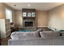 Cozy living room with stone fireplace and modern decor at 5609 Windwood Rd, Atlanta, GA 30349