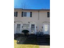 A townhouse exterior with a yard, window, and visible entryway at 405 Fairburn Sw Rd, Atlanta, GA 30331