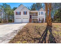 Inviting two-story home with a two-car garage and a charming front porch at 82 Austin Bridge Ln, Douglasville, GA 30134