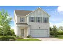 Charming two-story home with brick and siding exterior, well-manicured lawn, and inviting entry at 1744 Fawlocke Run, Loganville, GA 30052