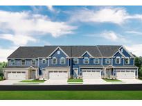 Charming blue townhomes with white garage doors and brick accents under a cloudy sky at , Mcdonough, GA 30253