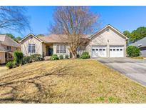 Charming single-story home with a well-maintained front yard and a two-car garage in a suburban neighborhood at 3710 Glen Ian Dr, Loganville, GA 30052