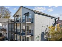 Modern home with multi-level balconies and sleek black railings showcasing contemporary outdoor living at 560 John Wesley Dobbs Ave, Atlanta, GA 30312