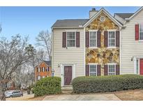 Charming townhome featuring stone accents and mature landscaping at 2510 Thorngate Dr, Acworth, GA 30101