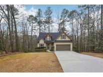 Charming single-Gathering home featuring a well-manicured lawn and a classic suburban design at 2845 Hickory Cir, Snellville, GA 30078